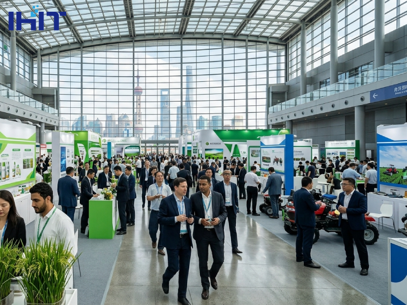 Modern exhibition hall in Shanghai host to an international crop protection trade show, with visitors examining plant samples amidst white and green booths.